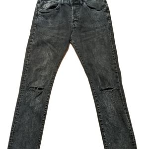 Acid washed ripped jeans